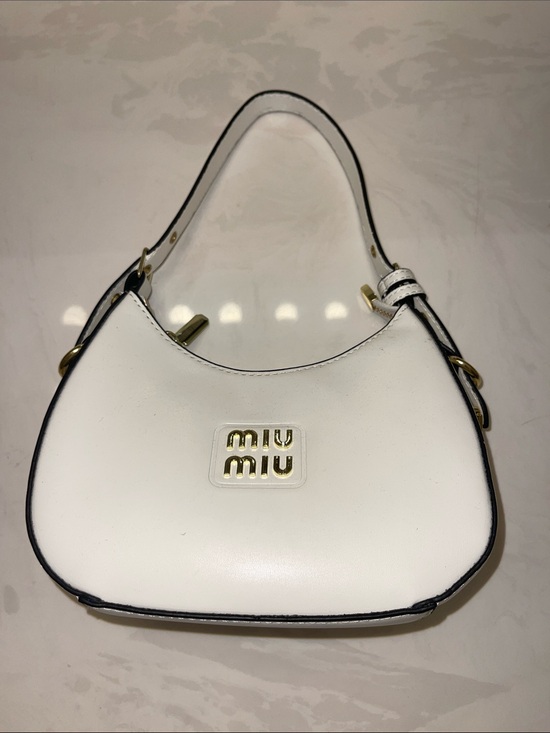 Miu Miu Handbags - Authentic Miu Miu White Leather Crescent Shoulder Bag with Gold Logo